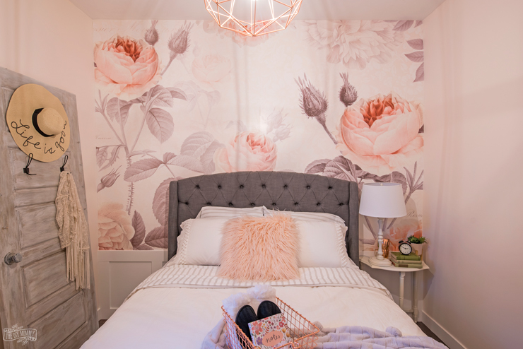 Feminine Modern Farmhouse Guest Bedroom Makeover with large floral wall mural, upholstered headboard, and blush pink, grey and copper colors