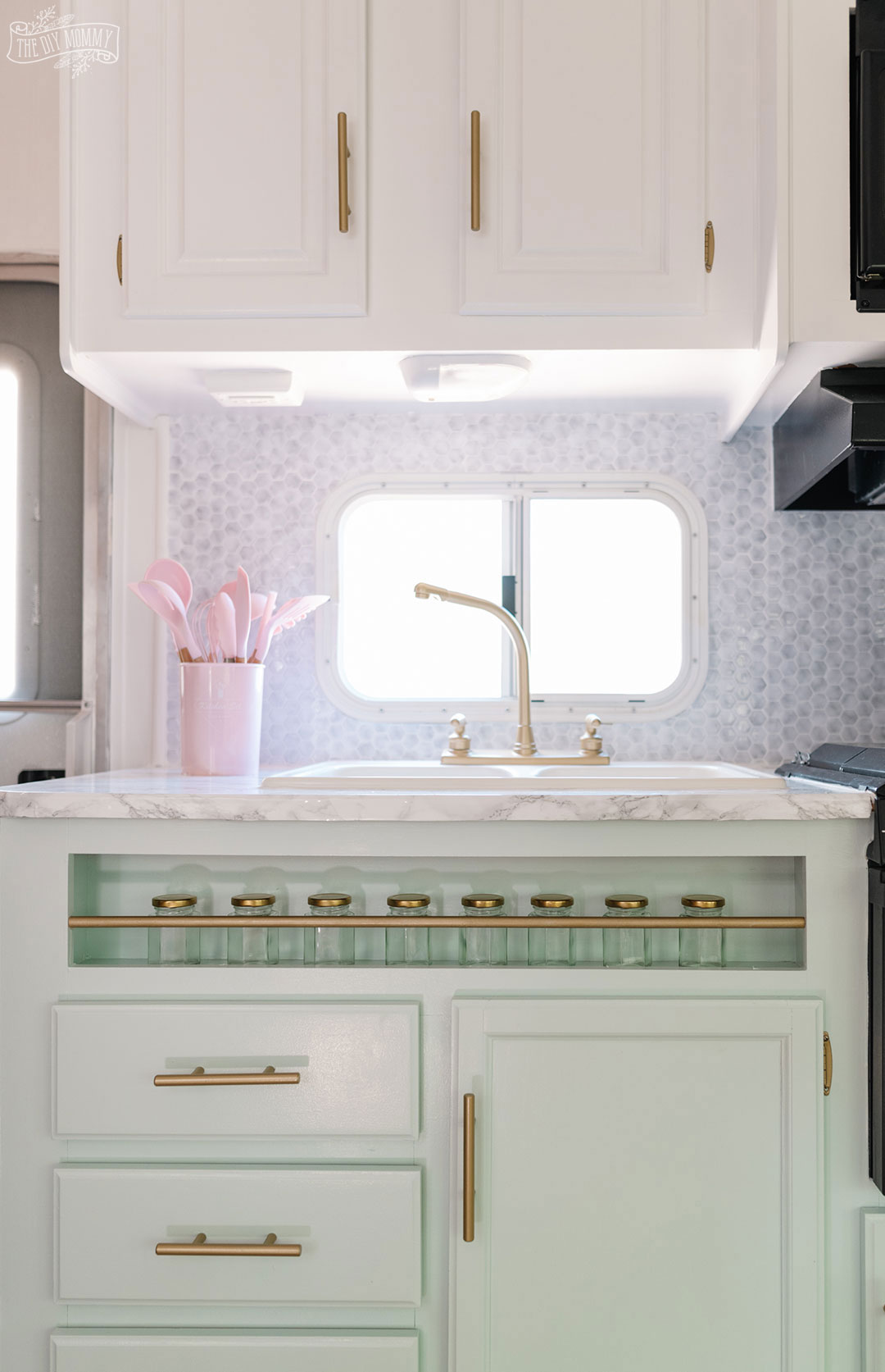 Glam RV Kitchen Makeover with white paint, mint green paint, and metallic gold accents